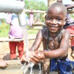Getting clean water from the borehole in Panycwala village, Laroo-Pece-Gulu, Uganda