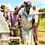 A woman from the Ated Wrot village in Nwoya, Uganda get clean water from the well recently drilled by Drop in the Bucket