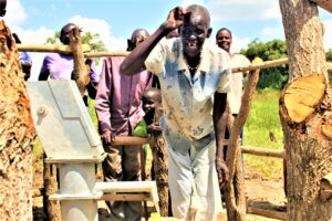 A woman from the Ated Wrot village in Nwoya, Uganda get clean water from the well recently drilled by Drop in the Bucket