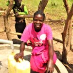 A woman from the Ated Wrot village in Nwoya, Uganda get clean water from the well recently drilled by Drop in the Bucket