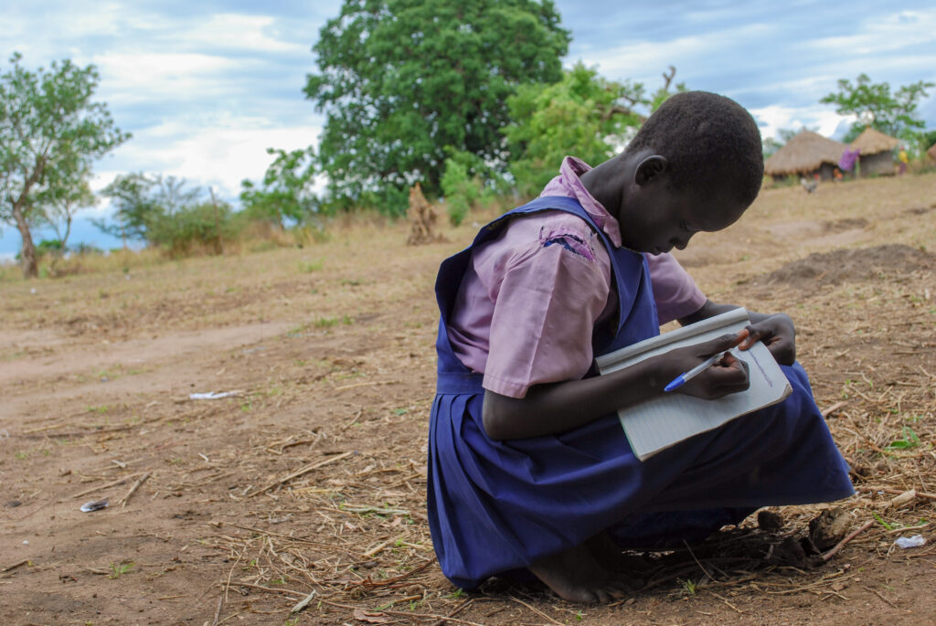 A girl studying in the open in Uganda