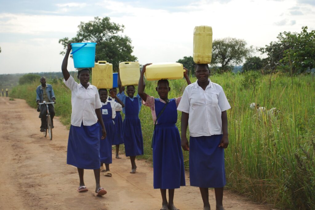 School children in Soroti, Uganda walking for water