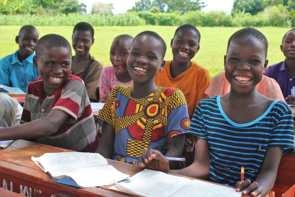 Girls sitting at their desks at a school in Uganda