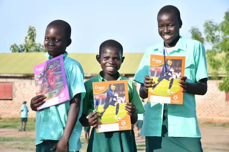 Three students from Green Valley Primary School attending a Safe Space after-school class in South Sudan