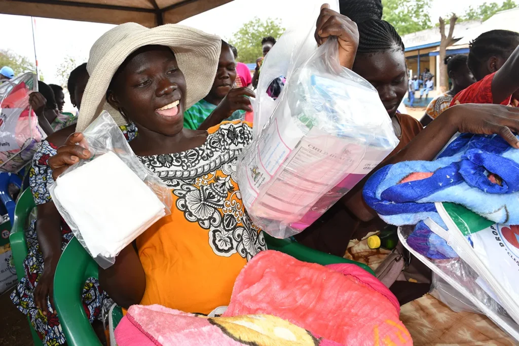 Expectant mother shows off her Mama Kit during a workshop in Nimule, South Sudan