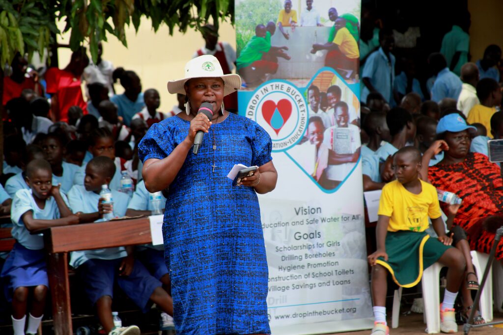 A woman speaks at an International Day of the Girl celebration in South Sudan